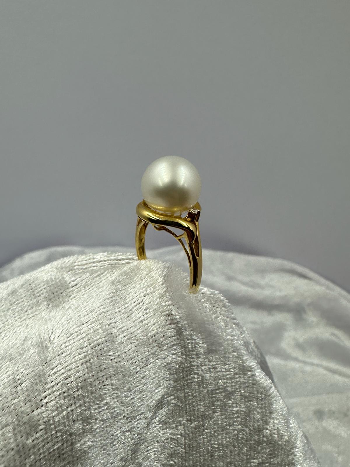 "A" rated pearl, 11.2mm with 18K Yellow Gold Ring