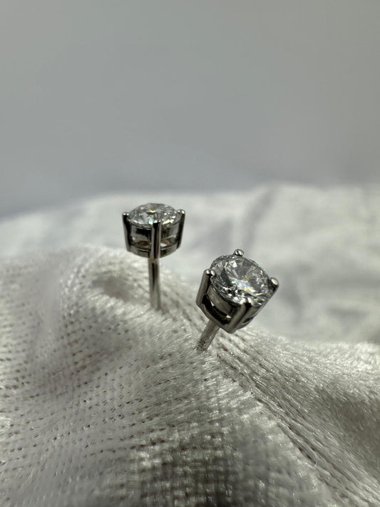 9K white gold 4 prong stud earrings with spring locks. 0.72 TDW lab grown