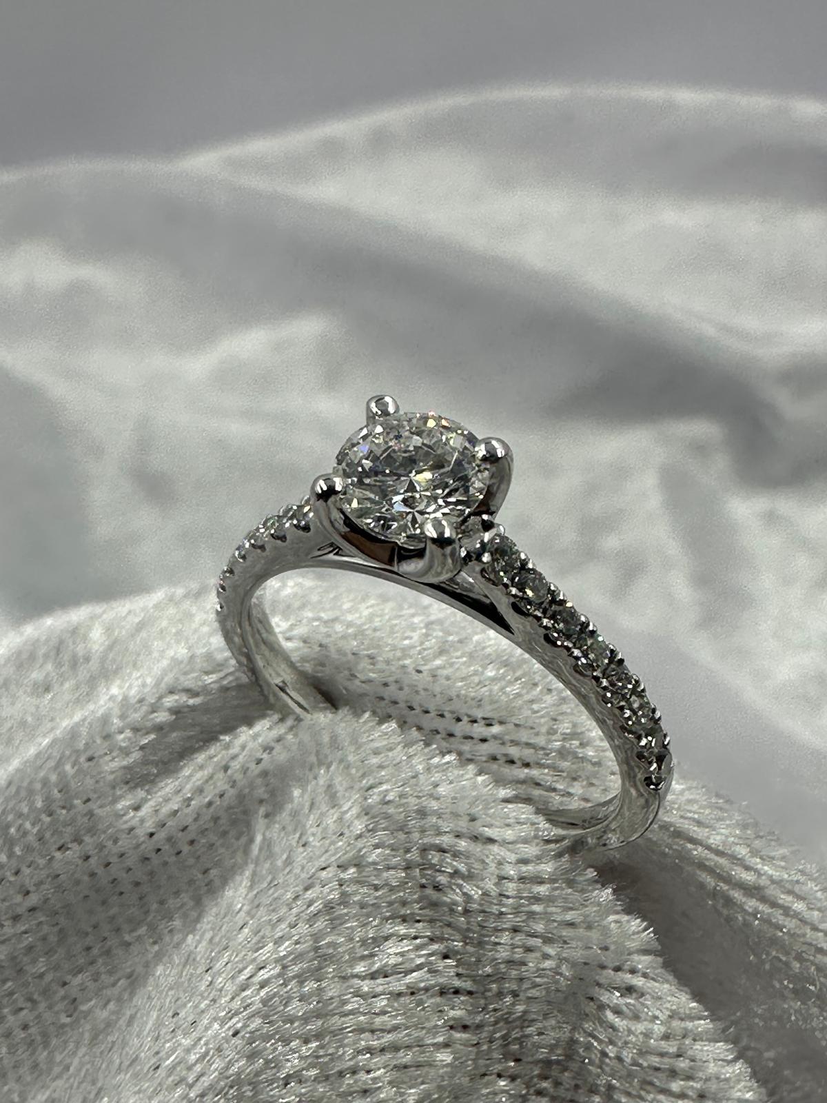 GIA certified 0.70 ct D/SI2 XXX NIL, 18K w/G pave set ring