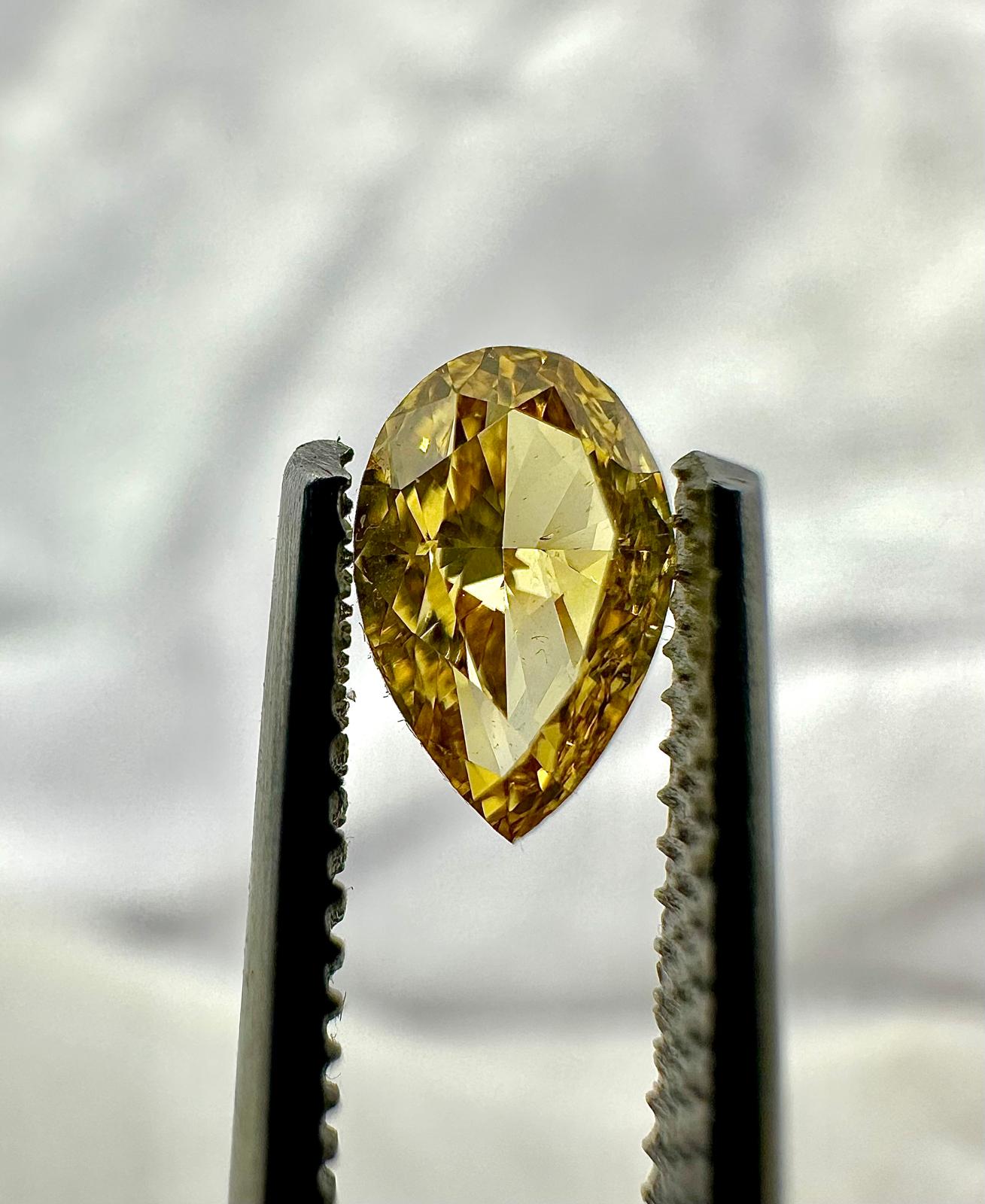 GIA Certified Pear brilliant 0.50ct Fancy Intense Orange-Yellow.