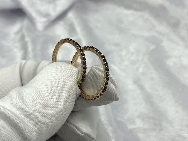 Matching pair of full sapphire eternity rings in 18K yellow gold