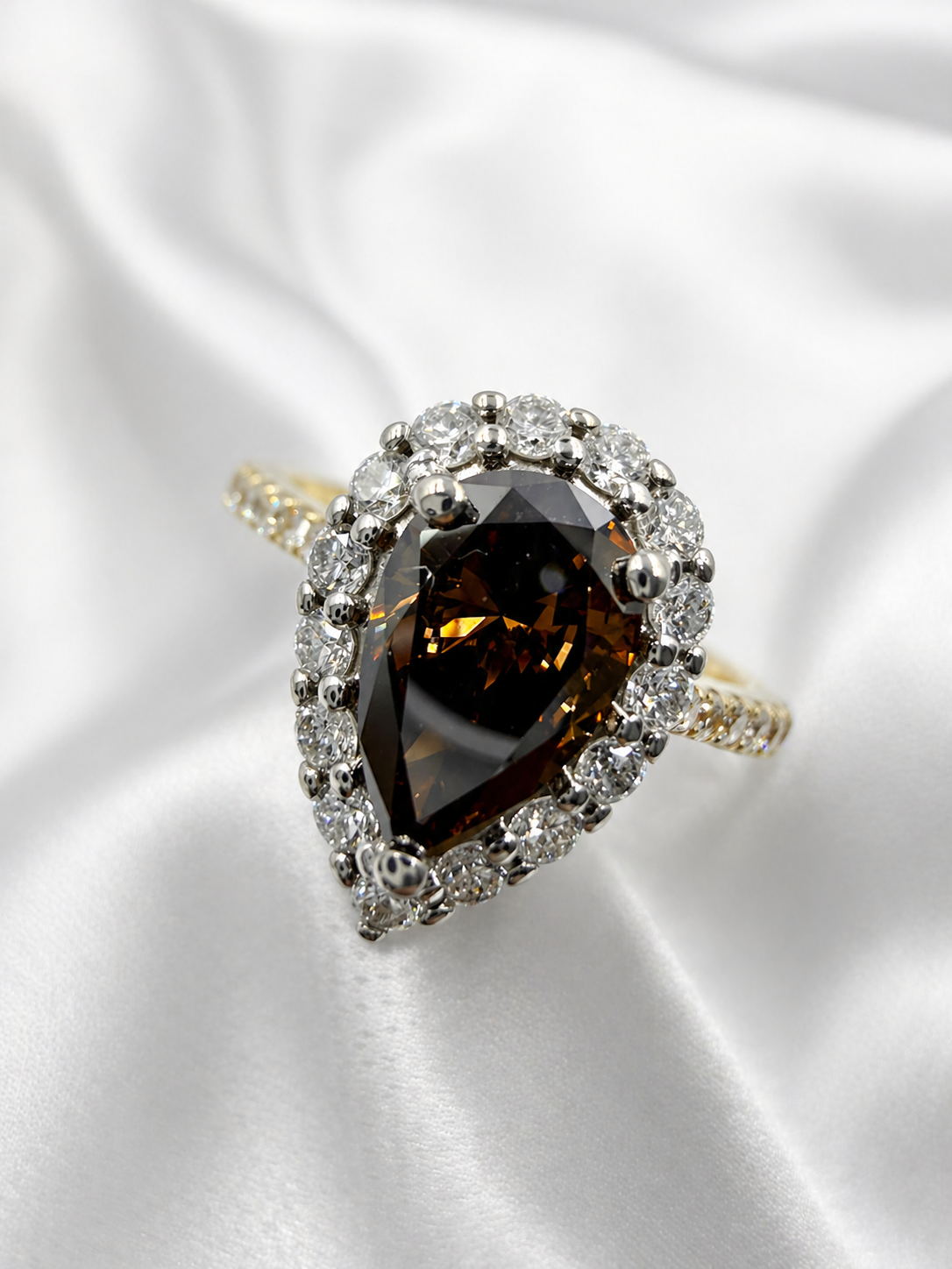 18K yellow and white gold halo ring with Fancy Dark Brown pear brilliant lab grown diamond