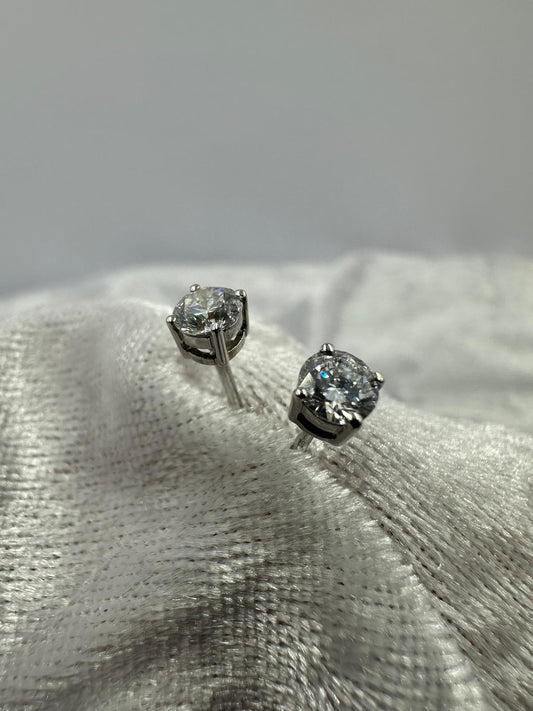 9K white gold 4 prong stud earrings with spring locks. 1.01 TDW lab grown