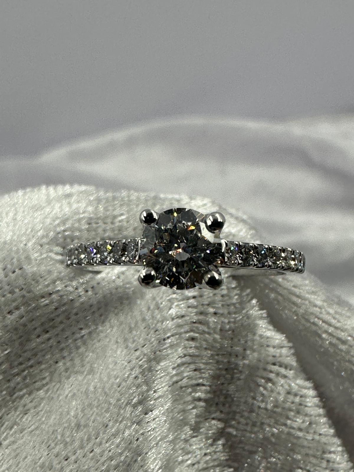 GIA certified 0.70 ct D/SI2 XXX NIL, 18K w/G pave set ring
