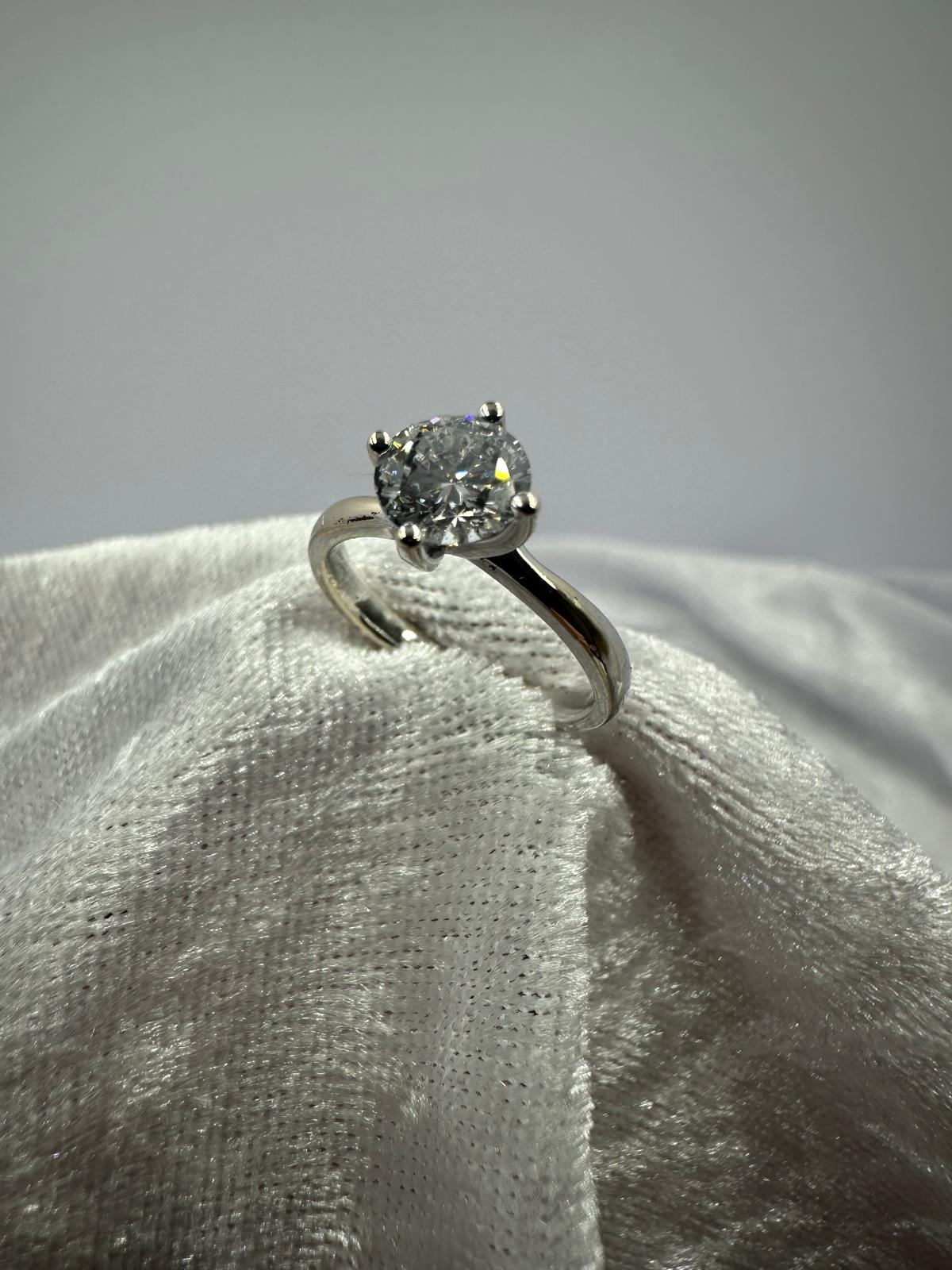 GIA certified round brilliant Twist claw solitaire diamond ring,