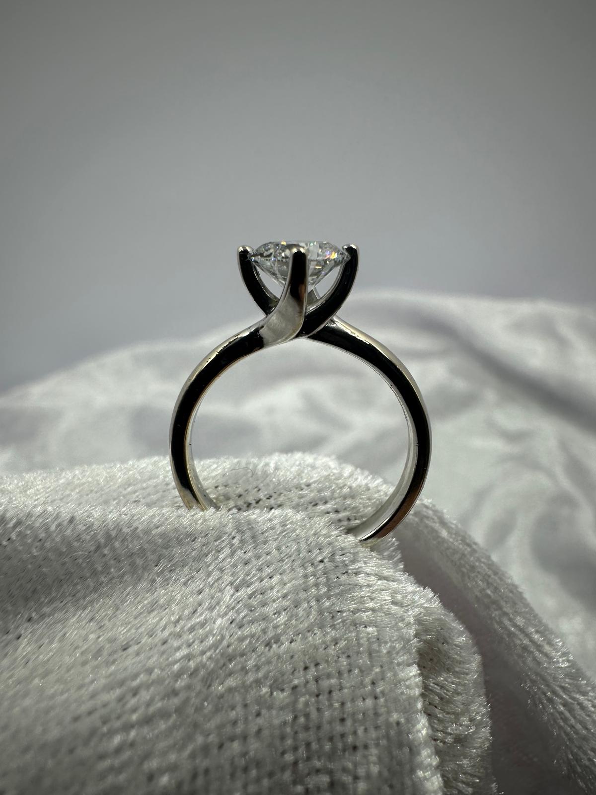 GIA certified round brilliant Twist claw solitaire diamond ring,