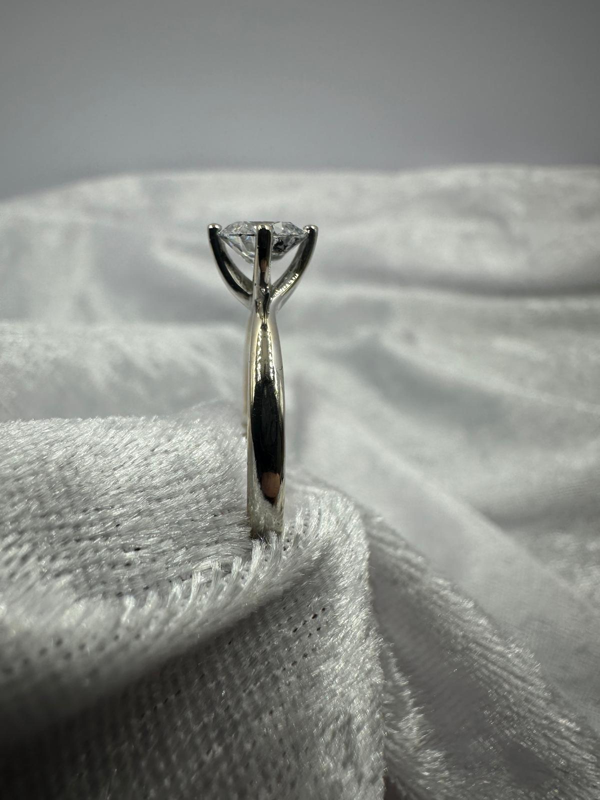 GIA certified round brilliant Twist claw solitaire diamond ring,