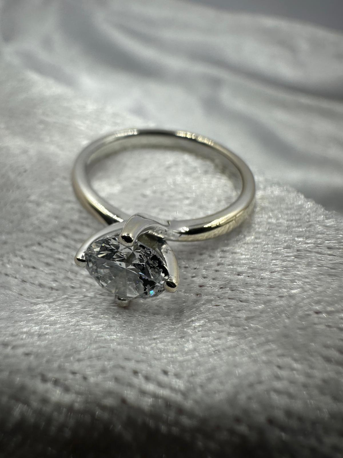 GIA certified round brilliant Twist claw solitaire diamond ring,