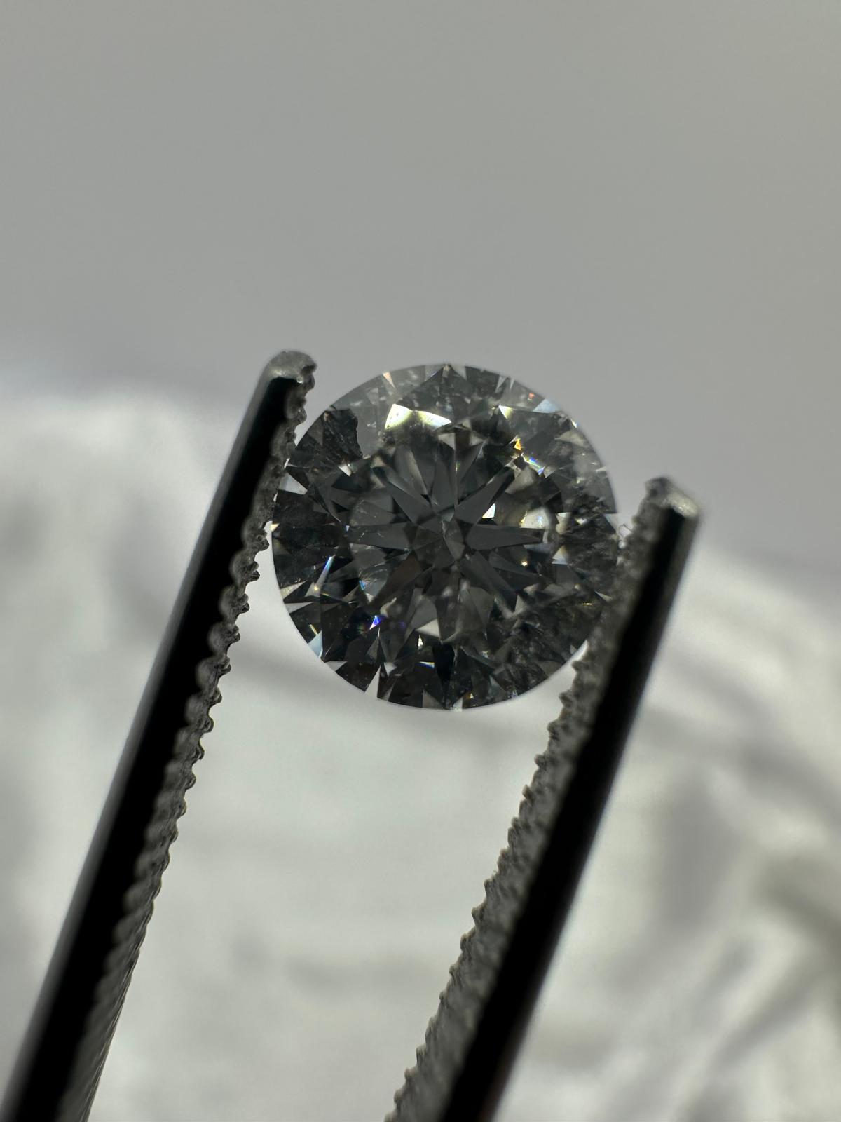 GIA certified round brilliant 1.01 ct F/SI1 EX/EX/VG Med,