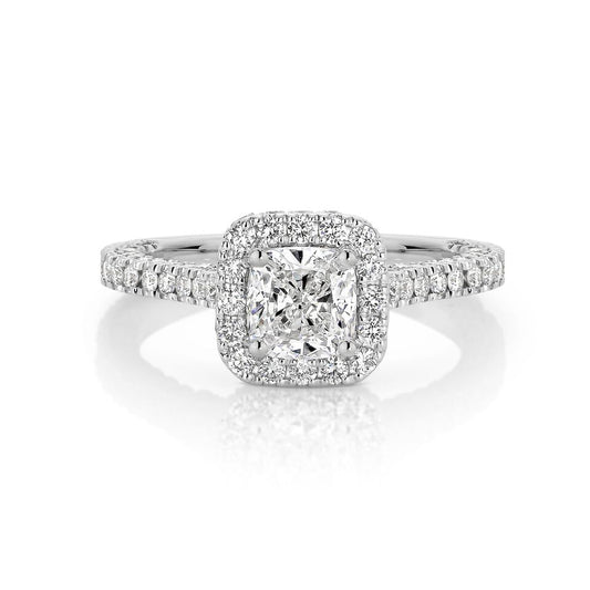 GIA certified cushion 1.00 ct F/SI2 set in 18K W/G micropave set halo ring. TCW 2.25+ cts