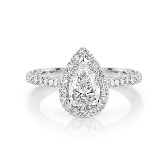 GIA certified pear 1.00 ct F/SI2 set in 18K W/G micropave set halo ring. TCW 2.25+ cts