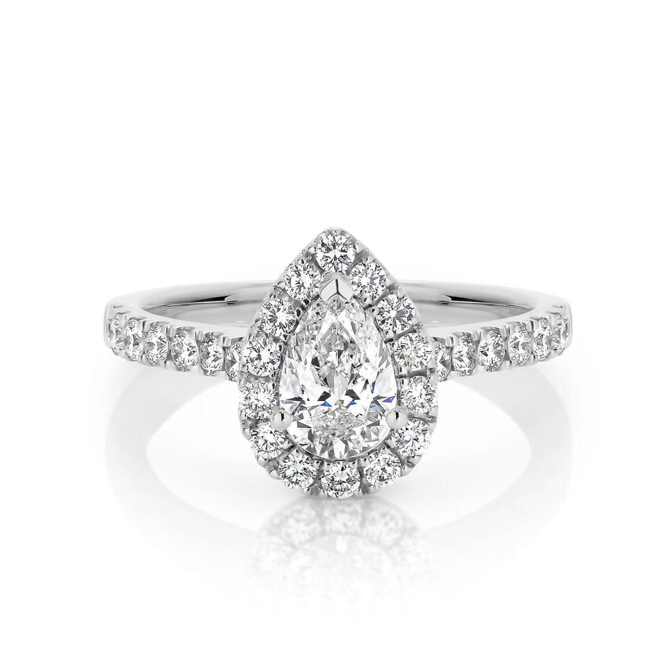 GIA certified pear 0.70 ct F/SI2 set in 18K W/G halo ring. TCW 1.20+ cts