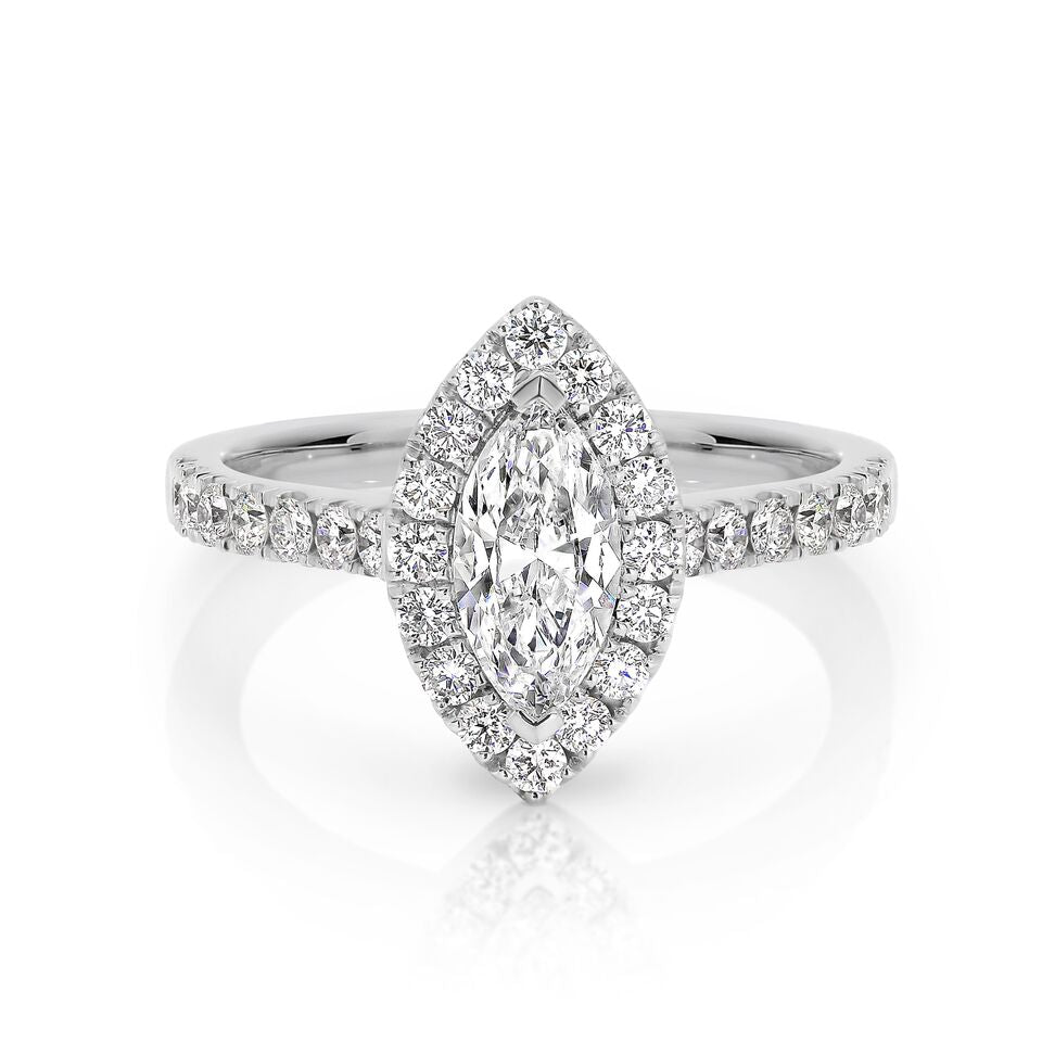 GIA certified marquise 0.70 ct F/SI2 set in 18K W/G halo ring. TCW 1.30+ cts