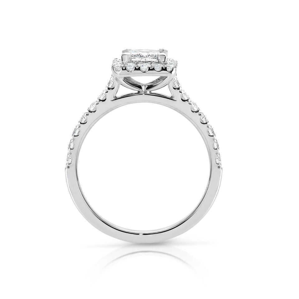 GIA certified princess 0.70 ct F/SI2 set in 18K W/G halo ring. TCW 1.20+ cts