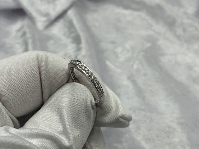 Grain set diamond wedding band, in use