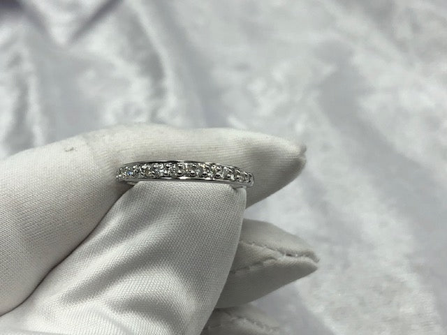 Grain set diamond wedding band, in use