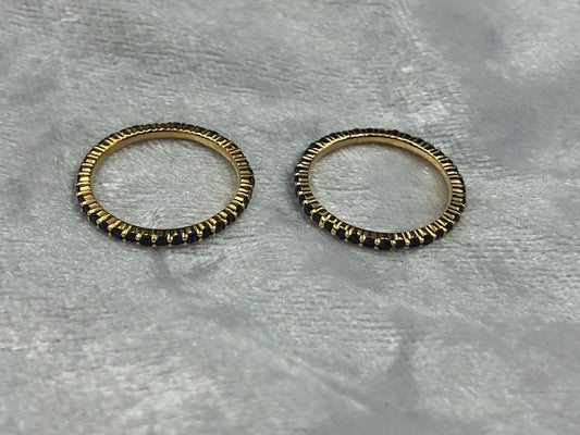 Matching pair of full sapphire eternity rings in 18K yellow gold, main product view