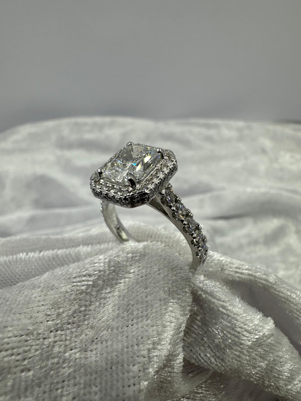 Stunning radiant cut lab grown and natural diamond halo ring. 2.99 TCW, angled view